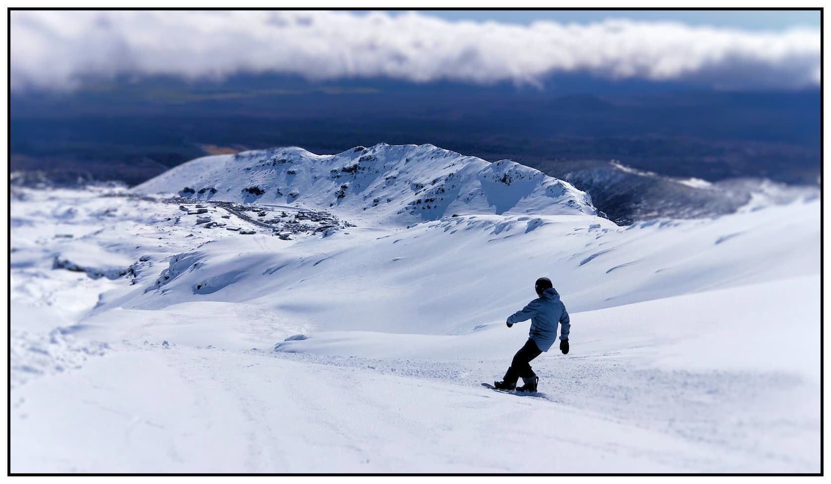 Snowboarding on Mt Ruapehu with mountain panorama